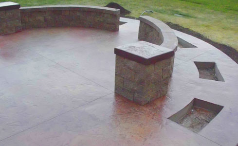 Stamped & Stained Concrete Patio with Brick Sitting Wall