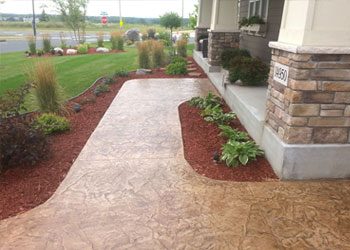 Stylish stamped concrete sidewalk and steps